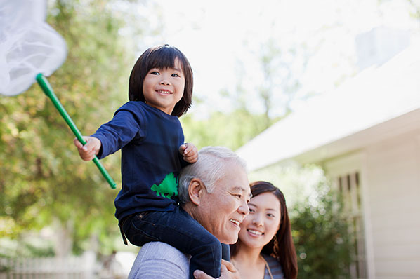 child-sitting-on-grandpas-shoulders-holding-net