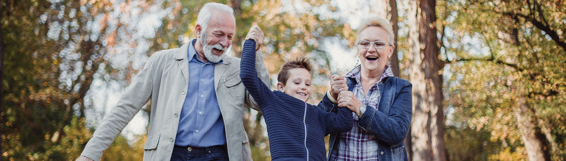 grandparents in park with grandson