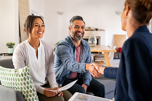 A couple speaking to an financial advisor