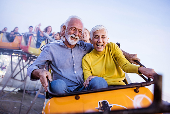 older couple riding the rollercoaster