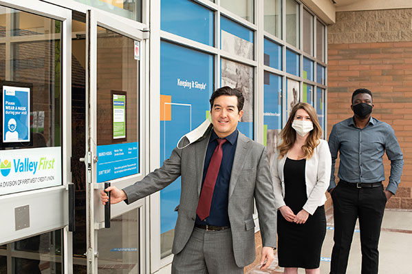 Valley First branch staff opening the door greeting clients