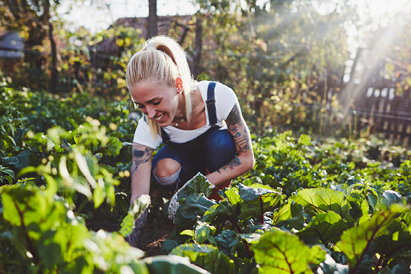 young woman gardening in her back yard