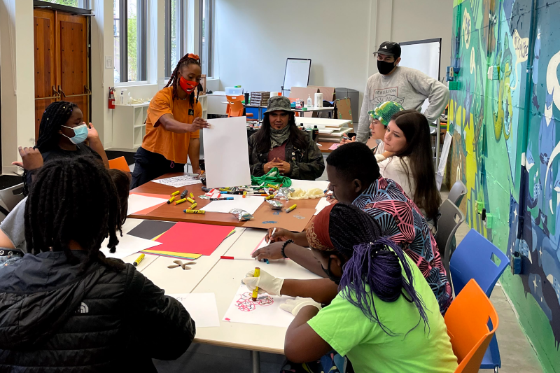 Kids making art at a common table