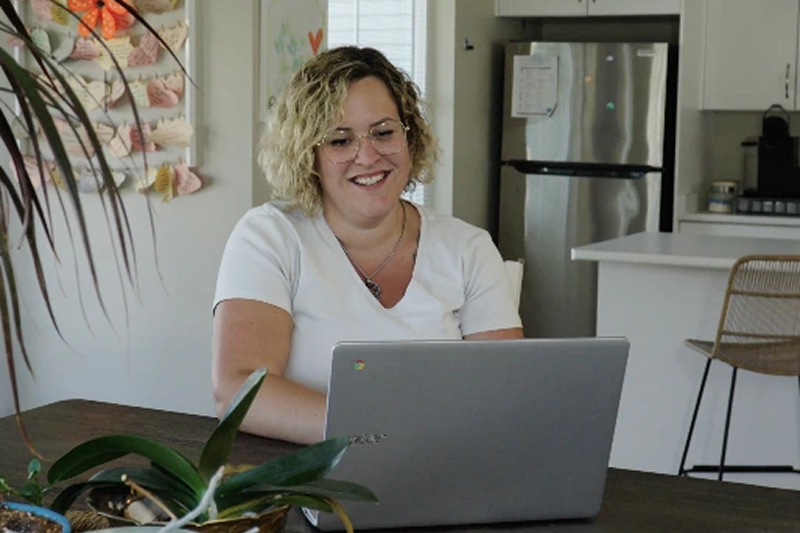 A woman working on a laptop