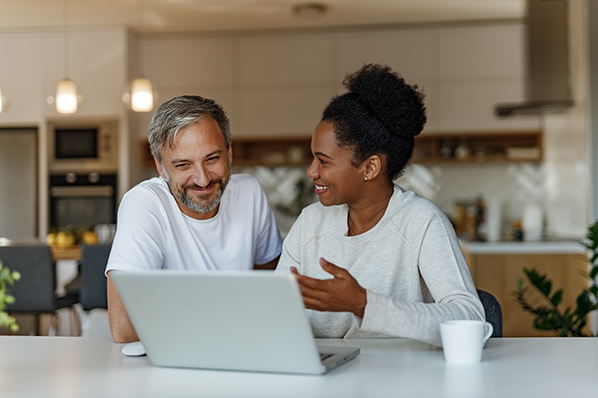 middle aged couple with laptop