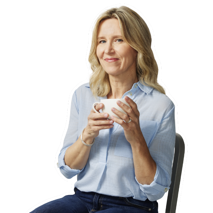smiling woman enjoying a cup of coffee