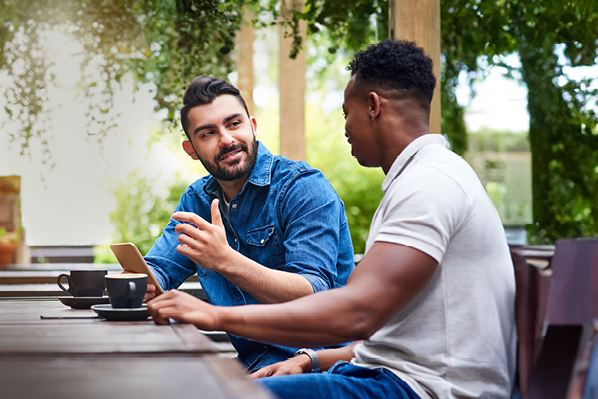Two friends chatting over coffee