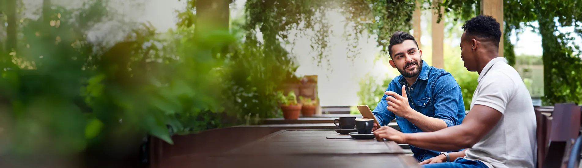Two friends chatting over coffee