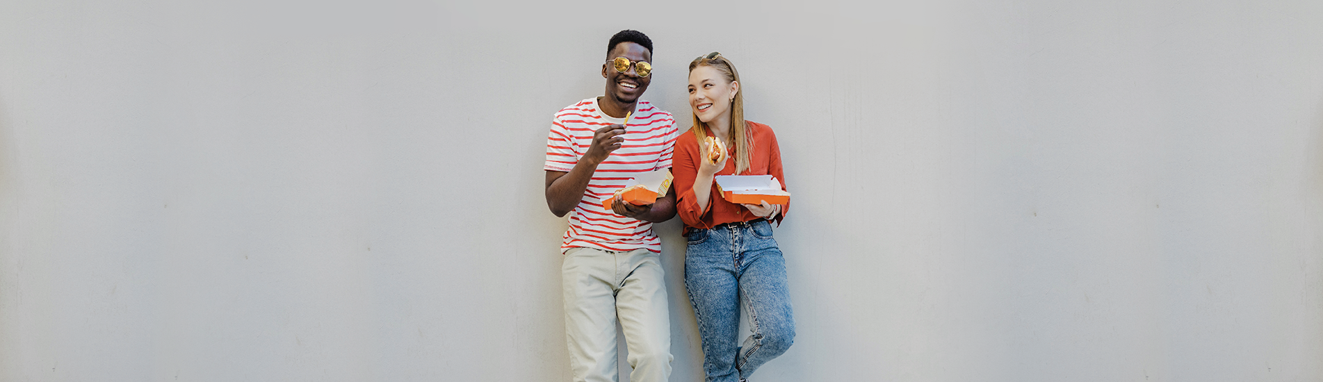 young adults eating food