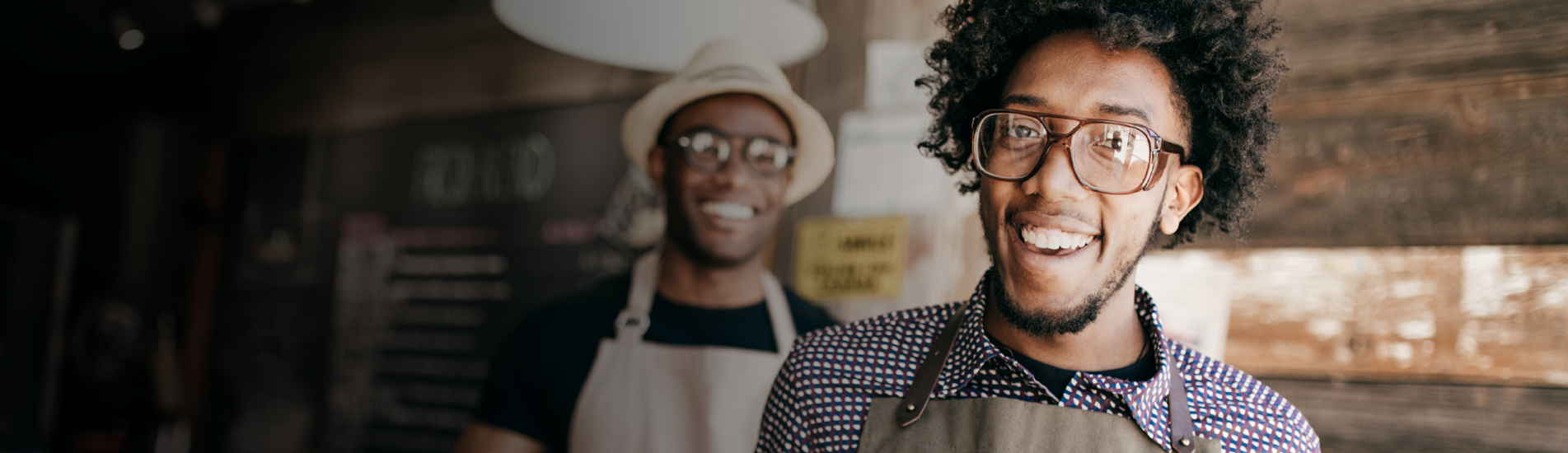 A man wearing an apron and smiling