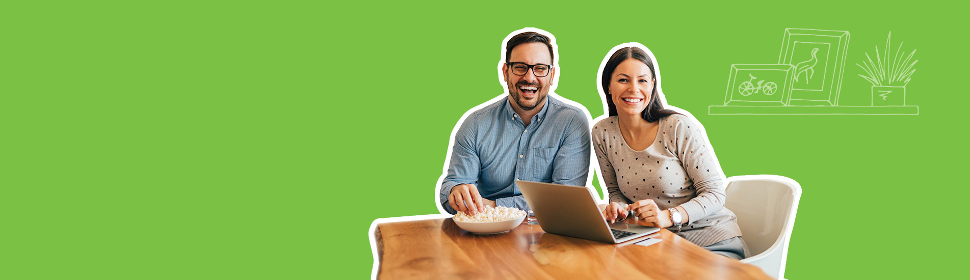 smiling couple  sitting at the table with their laptop.jpg
