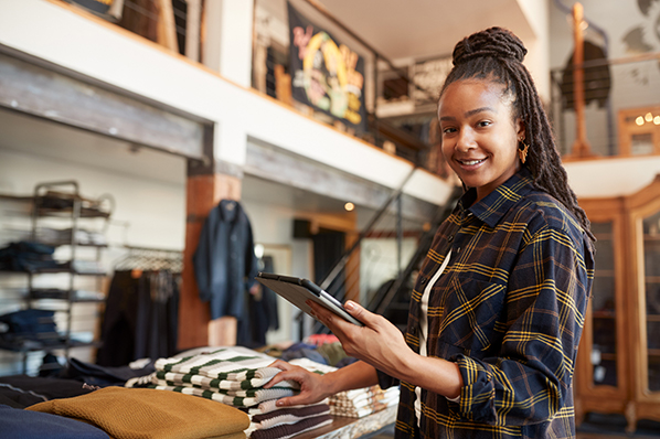 woman smiling in a clothing store.png